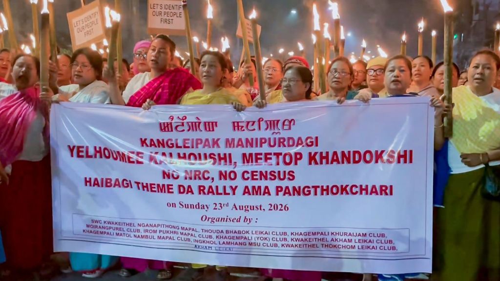 Women take part in protest rally as they hold flame torches demanding updation of the National Register of Citizens (NRC) before the Census in Manipur, at Khurai area, in Imphal, Sunday, Aug. 23, 2026. (PTI Photo)