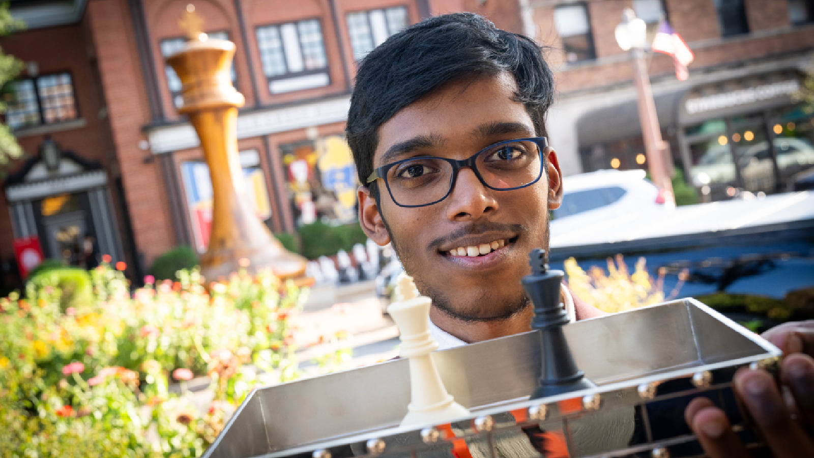 Praggnanandhaa poses with the 2026 GCT Finals trophy. (Lennart Ootes/Saint Louis Chess Club)
