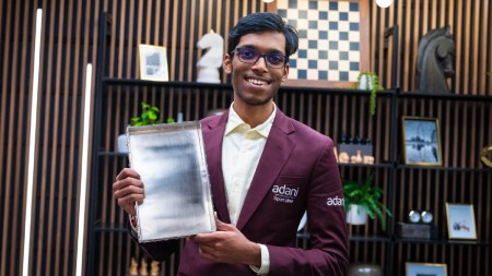 Praggnanandhaa poses with the 2026 GCT Finals trophy. (Lennart Ootes/Grand Chess Tour)