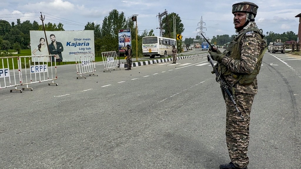 Kashmir: Security personnel keep vigil on the Jammu-Srinagar National Highway. (PTI Photo)