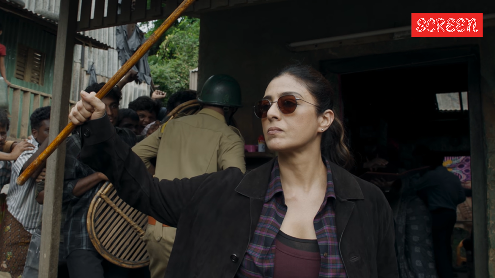 'We first shoot and then talk': Tabu slaps, wields lathi in Slumdog, watch teaser