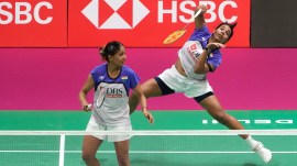 India's Treesa Jolly, right and Gayatri Gopichand Pullela play against China's Liu Sheng Shu and Tan Ning in a semi final match of the Badminton World Championships in New Delhi, India, Saturday, Aug. 22, 2026. (AP Photo/Manish Swarup)
