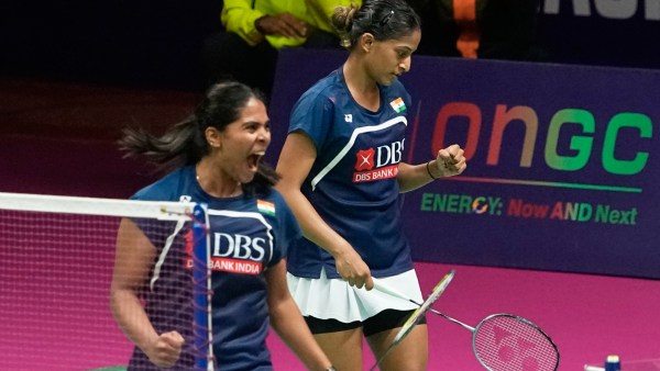 India's Gayatri Gopichand Pullela, and Treesa Jolly react after beating China's Jia Yi Fan and Zhang Shu Xian in the quarterfinal match of the Badminton World Championships in New Delhi.