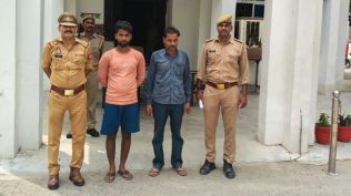 The father and son were booked on charges including assault, criminal intimidation and kidnapping.