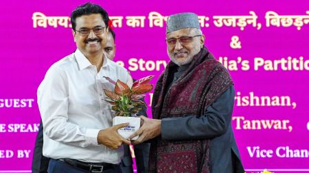 Vice President CP Radhakrishnan being presented with a sapling by Delhi University Vice-chancellor Yogesh Singh during a national seminar organised by the Centre for Independence and Partition Studies, Delhi University, in association with the Indian Council of Historical Research (ICHR) on the occasion of Partition Horrors Remembrance Day, at Multipurpose hall University of Delhi
