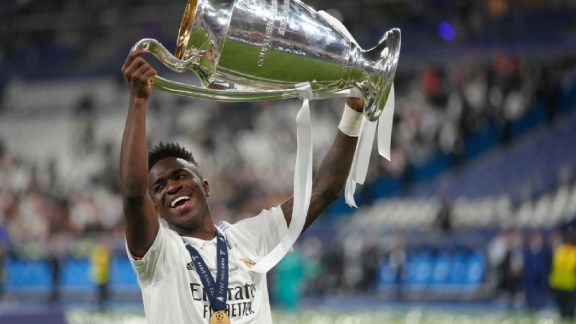 Real Madrid's Vinicius Junior holds up the trophy after winning the Champions League final soccer match between Liverpool and Real Madrid in Saint Denis near Paris, May 29, 2022. (AP Photo/Kirsty Wigglesworth, File)