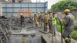 Rescue personnel at the building collapse site in Vrindavan, Uttar Pradesh.