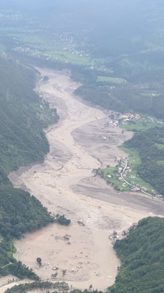  muddy area viewed from a helicopter, in the aftermath of flash floods, in Rasuwa district, Nepal August 26, 2026 in this still image obtained from social media video. Pradip Pandit/Alpine Kailash Trek Pvt Ltd/via REUTERS