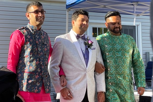 This photo provided by Jolene Gosha shows Venus Patel, left, walking his friend, Pratik Jhaveri, center, down the wedding aisle in Collinsville, Ill., June 18, 2022. (AP)