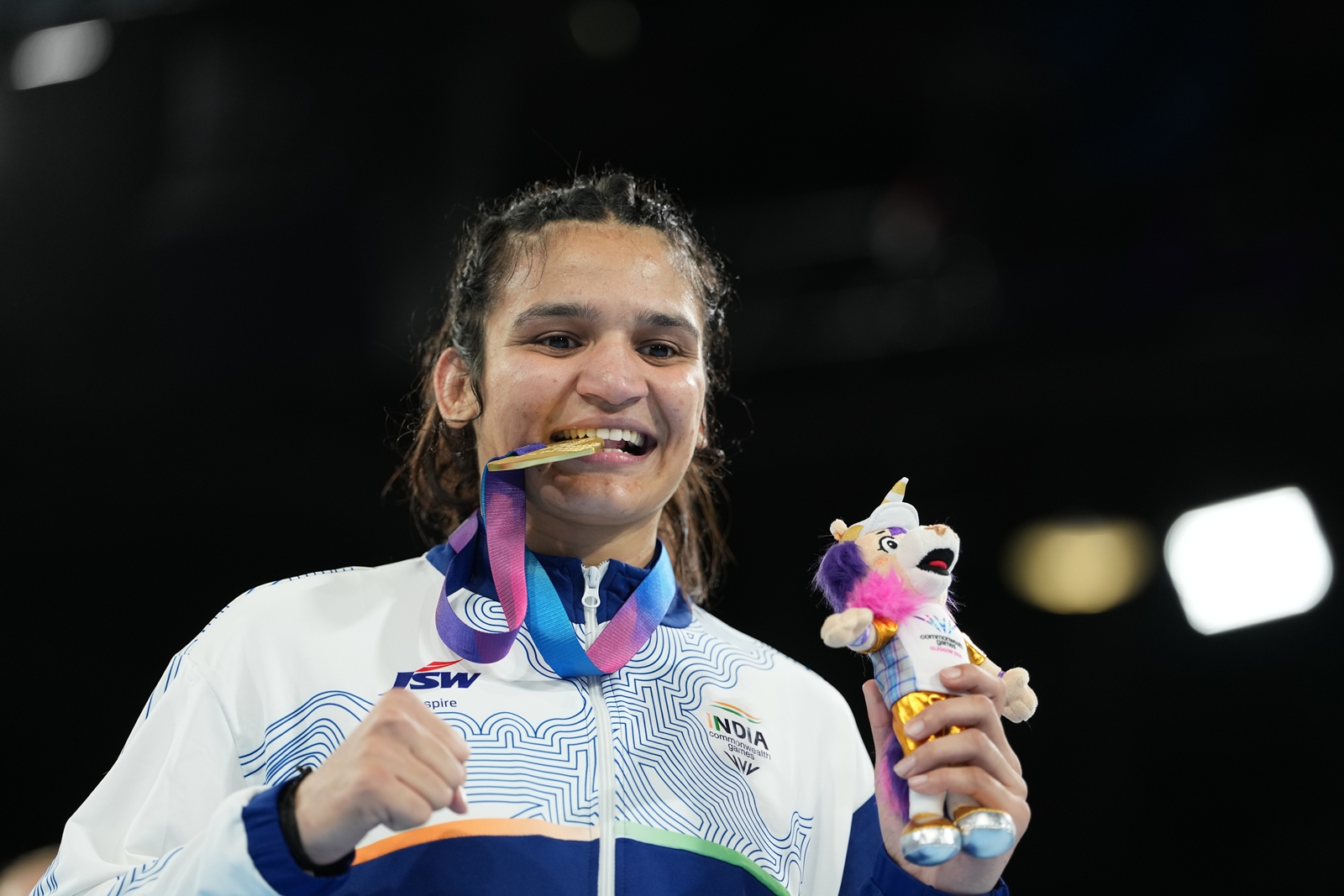 Arundhati Choudhary celebrates after winning the women's 70kg boxing final at the Commonwealth Games in Glasgow, Scotland, Saturday. (AP Photo)