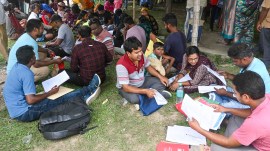 People whose names were deleted from voters' lists in the SIR in West Bengal queue up before a tribunal in Nadia district on April 7, 2026. (PTI Photo)