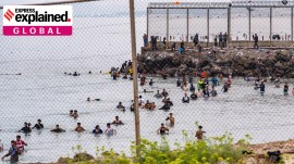Migrants try to cross from Morocco into the Spanish enclave of Ceuta, July 31.
