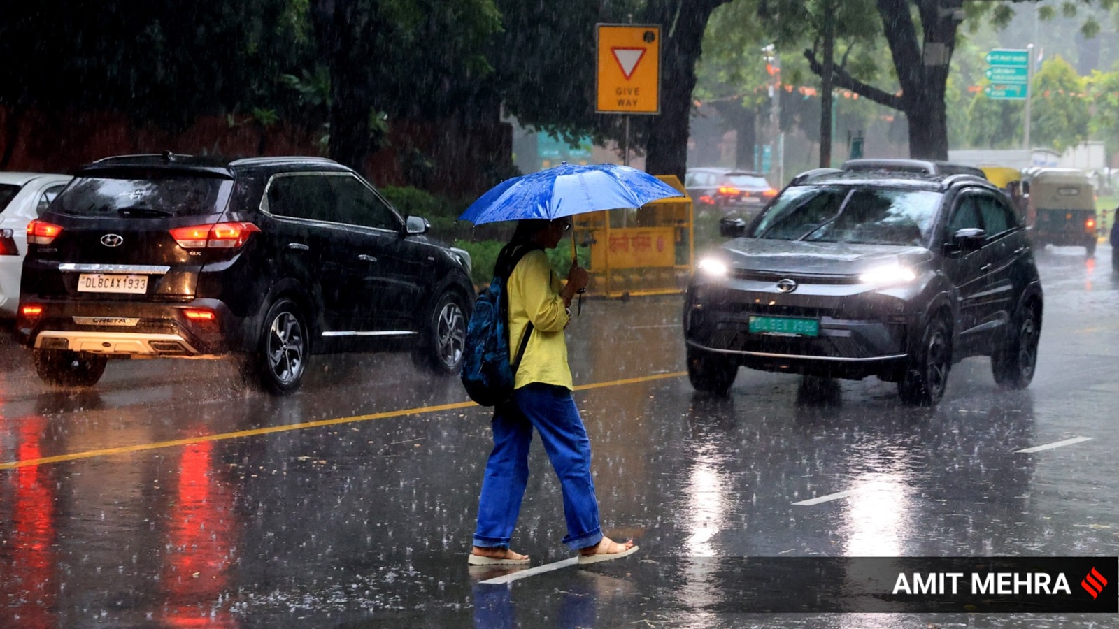Red alert in Delhi for heavy rain, temperatures dip