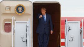 President Donald Trump gestures as he disembarks Air Force One upon his arrival at Joint Base Andrews, Md, Friday, Aug. 28, 2026. (AP Photo/Luis M. Alvarez)
