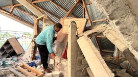 Arshad Hamid, an earthquake survivor, looks for valuables in his damaged house in North Lamba Leda, East Nusa Tenggara province, Indonesia, Wednesday, Aug. 19, 2026. (AP Photo/Firdia Lisnawati)