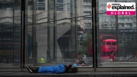 A homeless man sleeps on a street in a shopping district in central London, August 19. AP