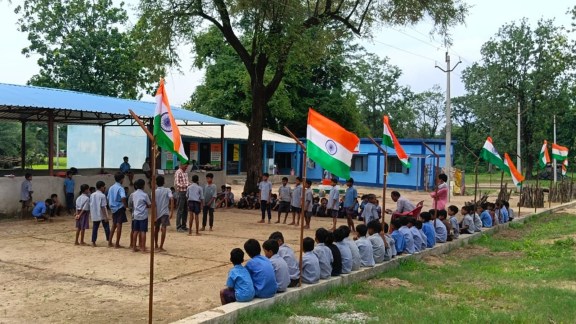 Children at the new school building, with Tricolours fluttering in the open compound, days ahead of Independence Day