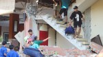 People evacuate from a building collapse at Jayakarta hotel following an earthquake of magnitude 7.7, in Labuan Bajo, East Nusa Tenggara, Indonesia, August 15, 2026. (REUTERS)
