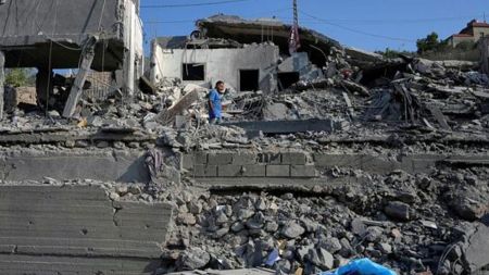 A man checks a destroyed home that was hit by an Israeli airstrike in Ansar village, southern Lebanon, Saturday. (AP Photo)