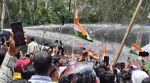 Jharkhand :As police used water cannons when the march reached Jagannathpur Temple, the demonstrators broke into dance, waving Tricolours on Monday. (Express photo by Shubham Tigga)