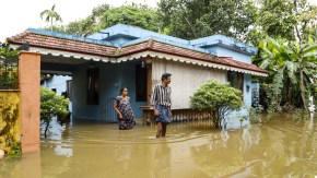 Residents wade through floodwaters outside their inundated homes after incessant monsoon rains caused widespread flooding, at Ranni, in Pathanamthitta district of Kerala, Monday, Aug. 3, 2026. (PTI Photo)