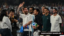 Argentine football star Lionel Messi along with his Inter Miami teammates Rodrigo De Paul and Luis Suarez are welcomed by football fans, as part of Messi's India tour, at Wankhede stadium in Mumbai on 14 December 2025. Also seen in former cricketer Sachin Tendulkar. (Express photo by Sankhadeep Banerjee)