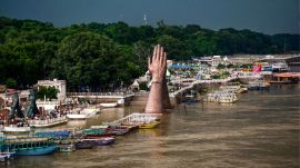 A swollen Ganga river at Namo Ghat as the water level rises following heavy rainfall, in Varanasi, Uttar Pradesh, Wednesday. (PTI Photo)