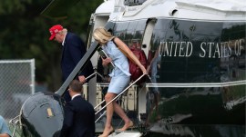President Donald Trump and executive assistant Natalie Harp step off from Marine One upon they arrival at the Ellipse just outside of the White House, Sunday, Aug. 16, 2026, in Washington. (AP Photo)