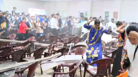 Attendees rush to safety after a portion of the false ceiling collapsed during a cultural event at Netaji Subhas National Institute of Sports in Patiala on Saturday. (Express Photos By Harmeet Sodhi)