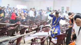 Attendees rush to safety after a portion of the false ceiling collapsed during a cultural event at Netaji Subhas National Institute of Sports in Patiala on Saturday. (Express Photos By Harmeet Sodhi)