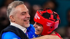 Sakshi Chaudhary celebrates with coach Santiago Nieva after winning the women's 51kg final boxing bout against England's Ruby White at the 23rd Commonwealth Games (CWG). (PTI Photo)