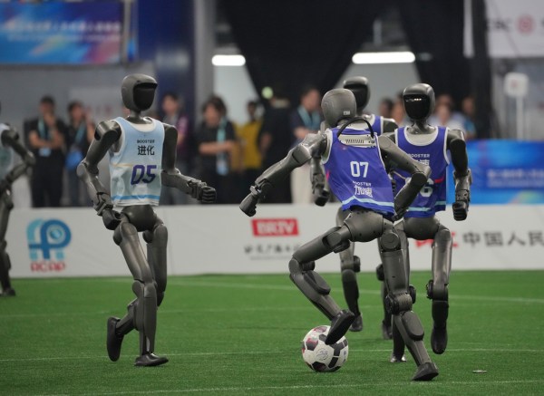 robots play soccer