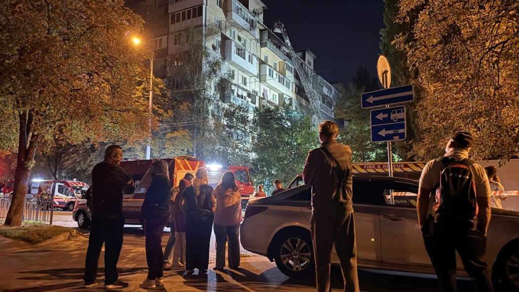 Residents stand at a site of an apartment building destroyed by a Russian drone strike, amid Russias attack on Ukraine, in Kyiv, August 29, 2026. (Reuters)