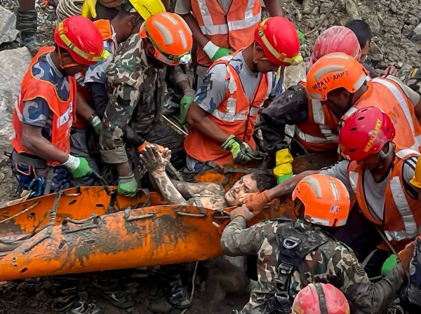 In this image received on Sept. 4, 2026, Nepal army personnel and other officials rescue Kabir Maharjan, 45, from a tunnel at the Trishuli 3A hydropower project 10 days after the Bhotekohi flash floods disaster, in Rasuwa district. (PTI photo)
