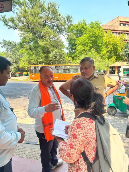 Adwitiyaa speaking to DTC workers about their working conditons