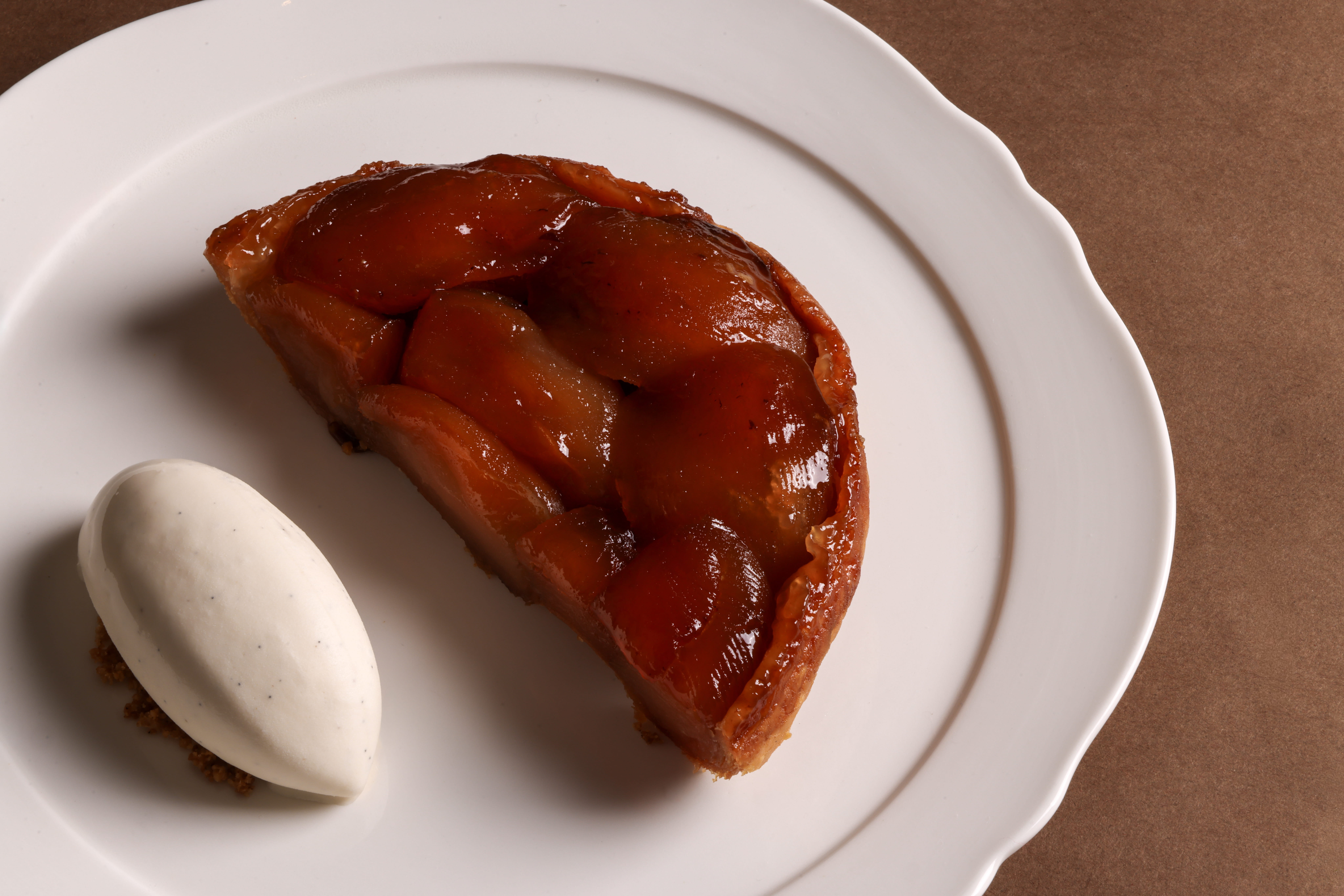 The Apple Tarte Tatin at La Panthera features three-hour-baked apples on filo pastry, served with caramel and Calvados vanilla ice cream.
