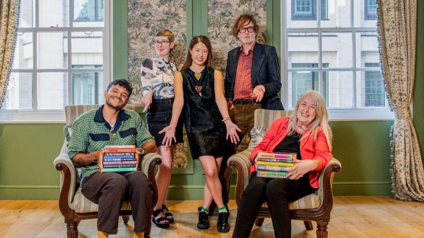 The Booker Prize 2026 judges – Raymond Antrobus, Patricia Lockwood, Rebecca Liu, Jarvis Cocker and Mary Beard – with the longlisted books. (Credit: Neo Gilder for Booker Prize Foundation)