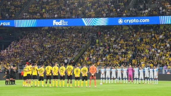 Players observe a minute of silence for the victims of the tragedy in Nepal before the Champions League opening phase soccer match between Borussia Dortmund and Villarreal in Dortmund, Germany, Tuesday, Sept. 8, 2026. (AP Photo/Martin Meissner)