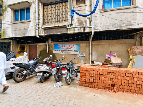 A wall hoarding advertising Khan Baba’s traditional healing centre, where patients come for treatment