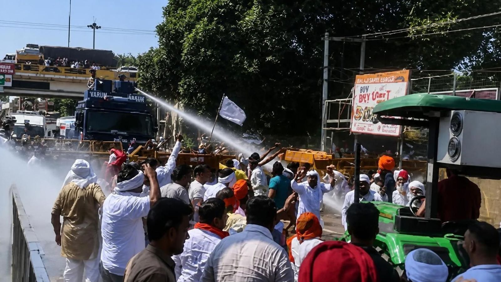 Haryana farmers block NH seeking early paddy procurement; cops use tear gas Haryana farmers block NH seeking early paddy procurement; cops use tear gas