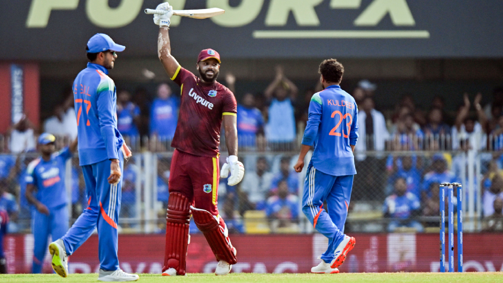 West Indies' John Campbell celebrates his 65-ball century during the 2nd ODI match between India and West Indies at ACA Stadium, in Guwahati on Wednesday.