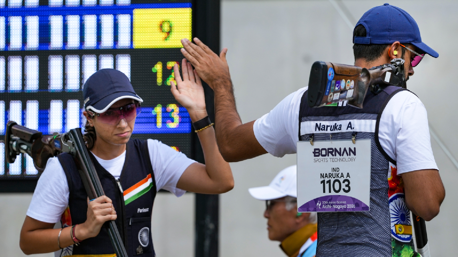 India’s Parinaaz Dhaliwal, left, and Anant Jeet Singh Naruka compete in the Skeet Mixed Team qualification during the 20th Asian Games, in Nagoya, Japan, Thursday, Sept. 24, 2026.