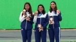 India's Raiza Dhillon, Maheshwari Chauhan and Parinaaz Dhaliwal pose with the team bronze medal on the podium.