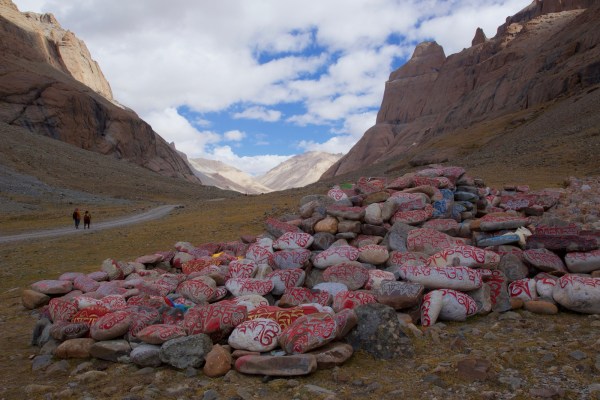 Mani stones on the path around Mount Kailash (Wikipedia)