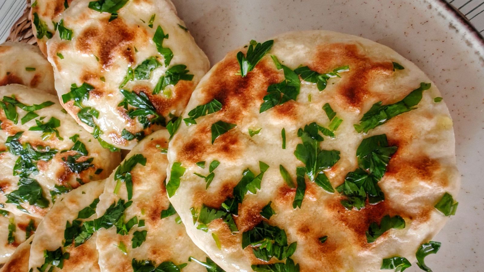 A well-made kulcha should have a crisp, blistered exterior and a soft, tender centre.