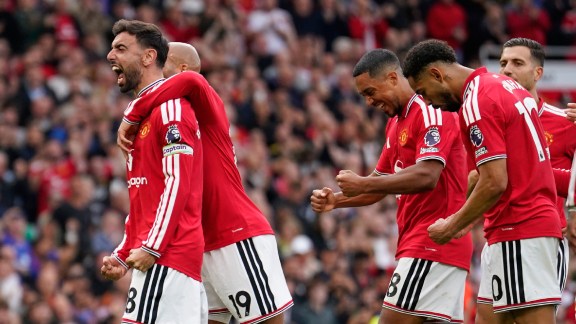Manchester United's Bruno Fernandes, left, celebrates after scoring his side's third goal during the English Premier League soccer match between Manchester United and Ipswich Town in Manchester, England, Sunday, Aug. 30, 2026. (AP Photo/Dave Thompson)