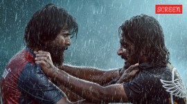 Mandaadi Actors Soori and Suhas in a still from the film Mandaadi