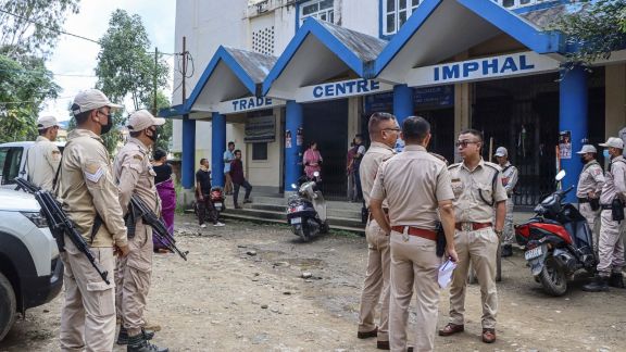 Manipur Police personnel stand guard outside the Sub-Divisional Officer (SDO) Office at Porompat after members of the Campaign for Just and Fair Delimitation (JFD) locked the office during their protest, in Imphal on Friday. (ANI Photo)