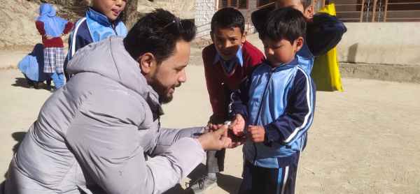 Mohd Mustafa Kamal - Kindergarten student bringing him a cup-shaped stone