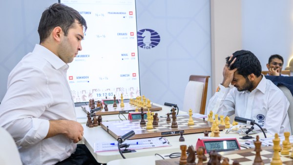 A dejected Nihal after blundering against Yakubboev. (Michal Walusza/FIDE)